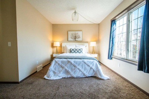 84 Hidden Green Nw, Calgary, AB - Indoor Photo Showing Bedroom