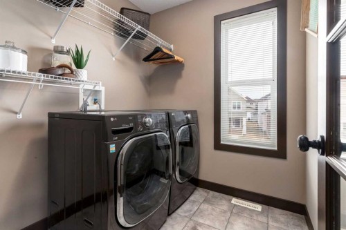 4 Copperpond Grove Se, Calgary, AB - Indoor Photo Showing Laundry Room