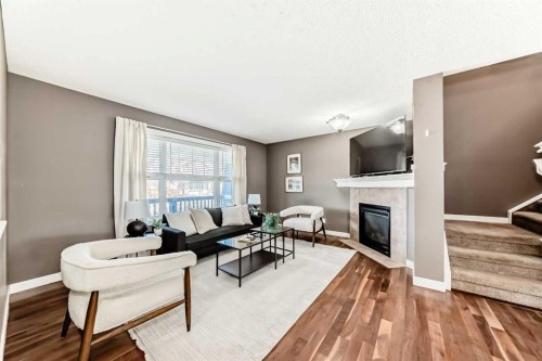 172 Morningside Manor Sw, Airdrie, AB - Indoor Photo Showing Living Room With Fireplace