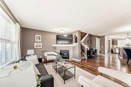 172 Morningside Manor Sw, Airdrie, AB - Indoor Photo Showing Living Room With Fireplace