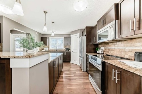 172 Morningside Manor Sw, Airdrie, AB - Indoor Photo Showing Kitchen With Upgraded Kitchen