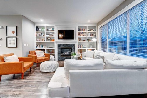 4418 19 Avenue Nw, Calgary, AB - Indoor Photo Showing Living Room With Fireplace