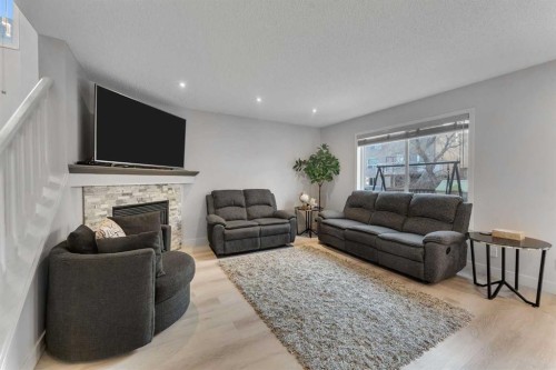199 Hawkmere Road, Chestermere, AB - Indoor Photo Showing Living Room With Fireplace