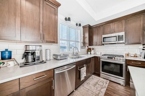 59 Wolf Hollow Way Se, Calgary, AB - Indoor Photo Showing Kitchen With Stainless Steel Kitchen With Double Sink