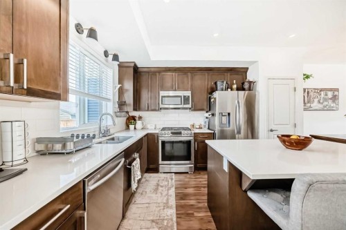 59 Wolf Hollow Way Se, Calgary, AB - Indoor Photo Showing Kitchen With Stainless Steel Kitchen With Double Sink With Upgraded Kitchen