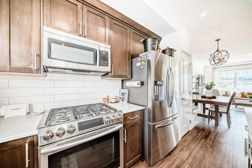 59 Wolf Hollow Way Se, Calgary, AB - Indoor Photo Showing Kitchen With Stainless Steel Kitchen