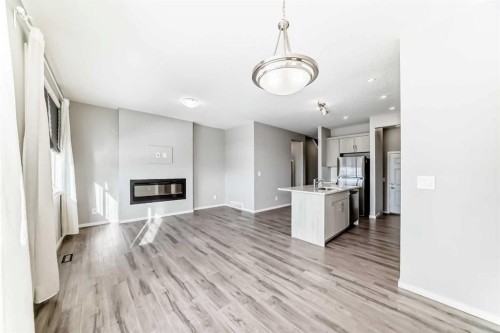 224 Carringham Way Nw, Calgary, AB - Indoor With Fireplace