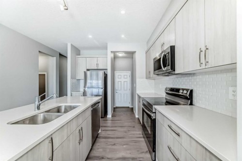 224 Carringham Way Nw, Calgary, AB - Indoor Photo Showing Kitchen With Stainless Steel Kitchen With Double Sink With Upgraded Kitchen