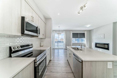 224 Carringham Way Nw, Calgary, AB - Indoor Photo Showing Kitchen With Stainless Steel Kitchen With Double Sink With Upgraded Kitchen