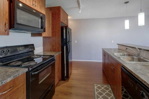 2429-700 Willowbrook Road Nw, Airdrie, AB - Indoor Photo Showing Kitchen With Double Sink
