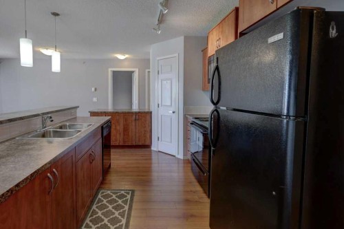 2429-700 Willowbrook Road Nw, Airdrie, AB - Indoor Photo Showing Kitchen With Double Sink