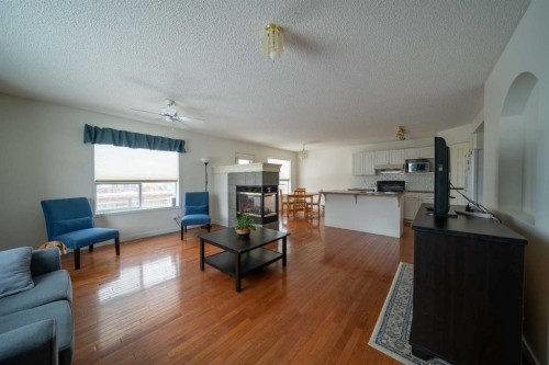 11 Arbour Stone Crescent Nw, Calgary, AB - Indoor Photo Showing Living Room
