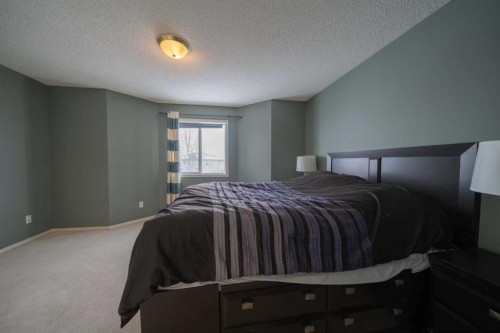 11 Arbour Stone Crescent Nw, Calgary, AB - Indoor Photo Showing Bedroom