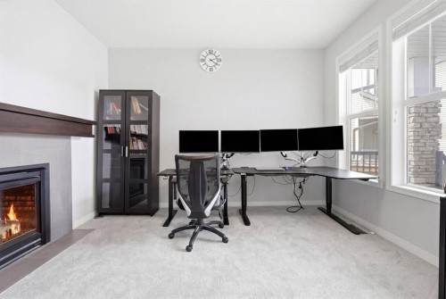 83 Nolanfield Court Nw, Calgary, AB - Indoor Photo Showing Office With Fireplace