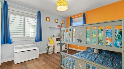 69 Sundown Grove, Cochrane, AB - Indoor Photo Showing Bedroom