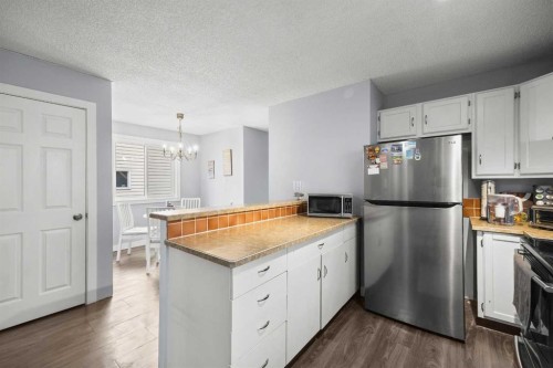 23 Edgedale Road Nw, Calgary, AB - Indoor Photo Showing Kitchen With Stainless Steel Kitchen