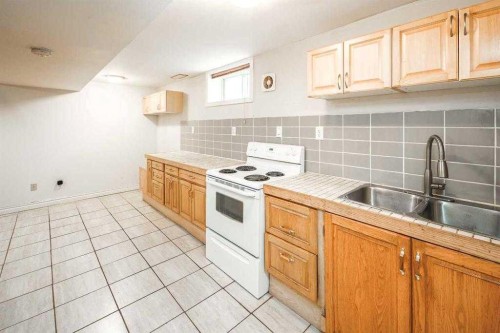 23 Edgedale Road Nw, Calgary, AB - Indoor Photo Showing Kitchen With Double Sink
