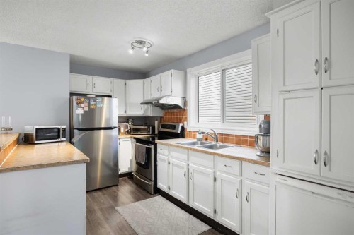 23 Edgedale Road Nw, Calgary, AB - Indoor Photo Showing Kitchen With Stainless Steel Kitchen With Double Sink