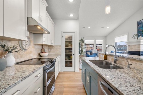 561 Boulder Creek Green Se, Langdon, AB - Indoor Photo Showing Kitchen With Double Sink With Upgraded Kitchen
