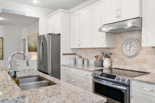 561 Boulder Creek Green Se, Langdon, AB - Indoor Photo Showing Kitchen With Double Sink With Upgraded Kitchen