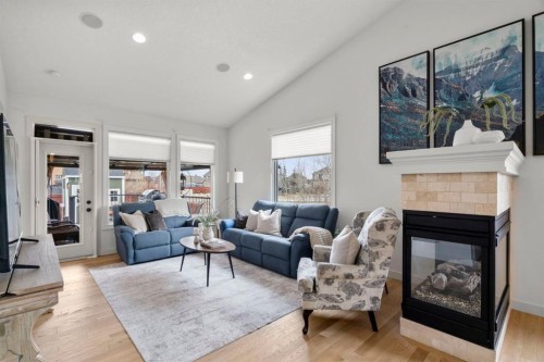 561 Boulder Creek Green Se, Langdon, AB - Indoor Photo Showing Living Room With Fireplace