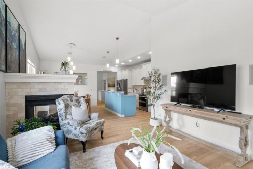 561 Boulder Creek Green Se, Langdon, AB - Indoor Photo Showing Living Room With Fireplace
