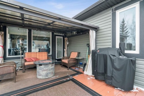 561 Boulder Creek Green Se, Langdon, AB - Outdoor With Deck Patio Veranda With Exterior