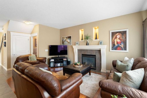 40 Bridleridge Lane Sw, Calgary, AB - Indoor Photo Showing Living Room With Fireplace