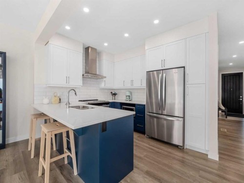 130 Crestridge Common Sw, Calgary, AB - Indoor Photo Showing Kitchen With Double Sink With Upgraded Kitchen