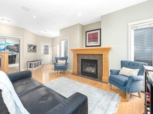 195 Royal Birkdale Crescent Nw, Calgary, AB - Indoor Photo Showing Living Room With Fireplace