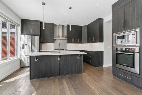 120 Aspen Dale Way Sw, Calgary, AB - Indoor Photo Showing Kitchen With Stainless Steel Kitchen With Upgraded Kitchen