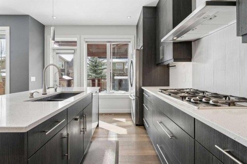 120 Aspen Dale Way Sw, Calgary, AB - Indoor Photo Showing Kitchen With Double Sink With Upgraded Kitchen