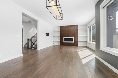 120 Aspen Dale Way Sw, Calgary, AB - Indoor With Fireplace