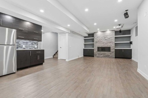 120 Aspen Dale Way Sw, Calgary, AB - Indoor With Fireplace