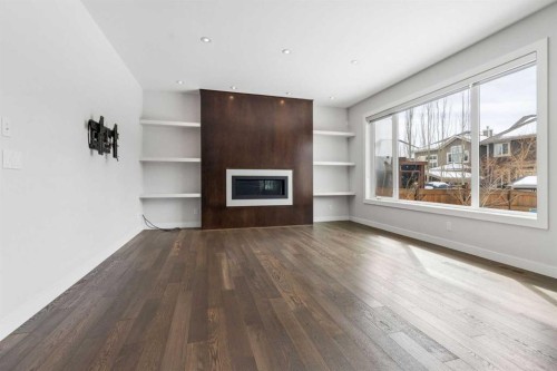 120 Aspen Dale Way Sw, Calgary, AB - Indoor Photo Showing Living Room With Fireplace