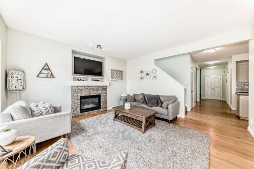 98 Mahogany Way Se, Calgary, AB - Indoor Photo Showing Living Room With Fireplace