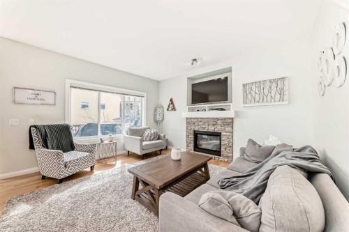 98 Mahogany Way Se, Calgary, AB - Indoor Photo Showing Living Room With Fireplace