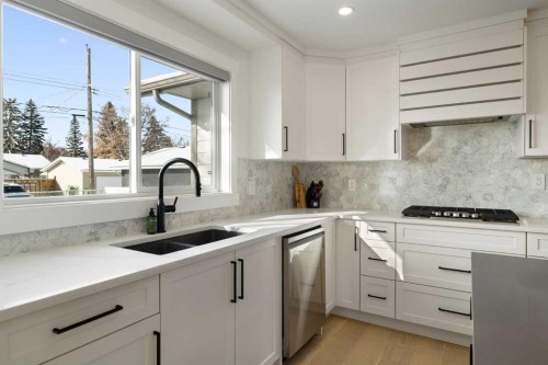 523 Athlone Road Se, Calgary, AB - Indoor Photo Showing Kitchen With Double Sink With Upgraded Kitchen
