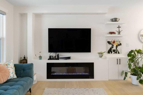 523 Athlone Road Se, Calgary, AB - Indoor Photo Showing Living Room With Fireplace