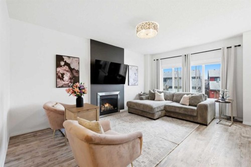 62 Walden Court Se, Calgary, AB - Indoor Photo Showing Living Room With Fireplace