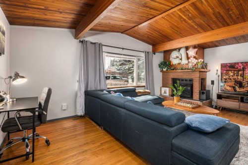 628 Seymour Avenue Sw, Calgary, AB - Indoor Photo Showing Living Room With Fireplace