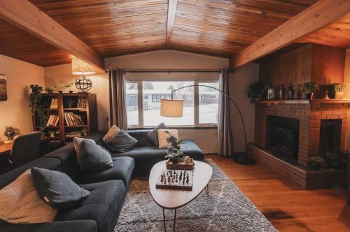 628 Seymour Avenue Sw, Calgary, AB - Indoor Photo Showing Living Room With Fireplace