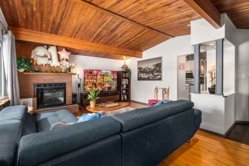 628 Seymour Avenue Sw, Calgary, AB - Indoor Photo Showing Living Room With Fireplace