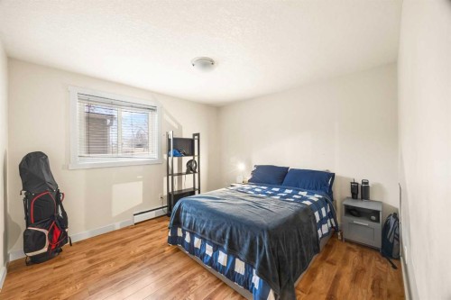 102-3103 Blakiston Drive Nw, Calgary, AB - Indoor Photo Showing Bedroom