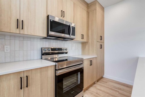 454 River Avenue, Cochrane, AB - Indoor Photo Showing Kitchen