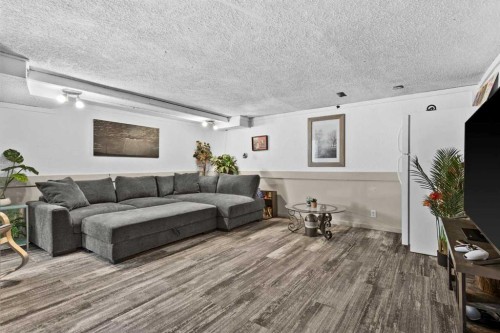 66 Elston Place Se, Airdrie, AB - Indoor Photo Showing Living Room