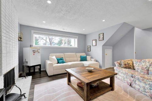 6584 Dalrymple Way Nw, Calgary, AB - Indoor Photo Showing Living Room With Fireplace