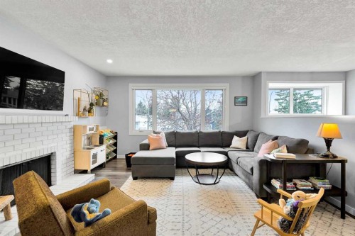6584 Dalrymple Way Nw, Calgary, AB - Indoor Photo Showing Living Room With Fireplace
