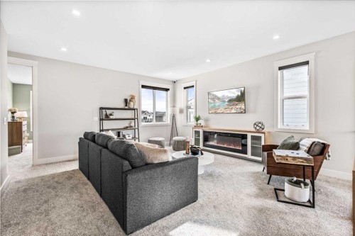 112 South Shore View, Chestermere, AB - Indoor Photo Showing Living Room With Fireplace