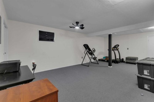 415 Bruce Avenue, Carbon, AB - Indoor Photo Showing Gym Room
